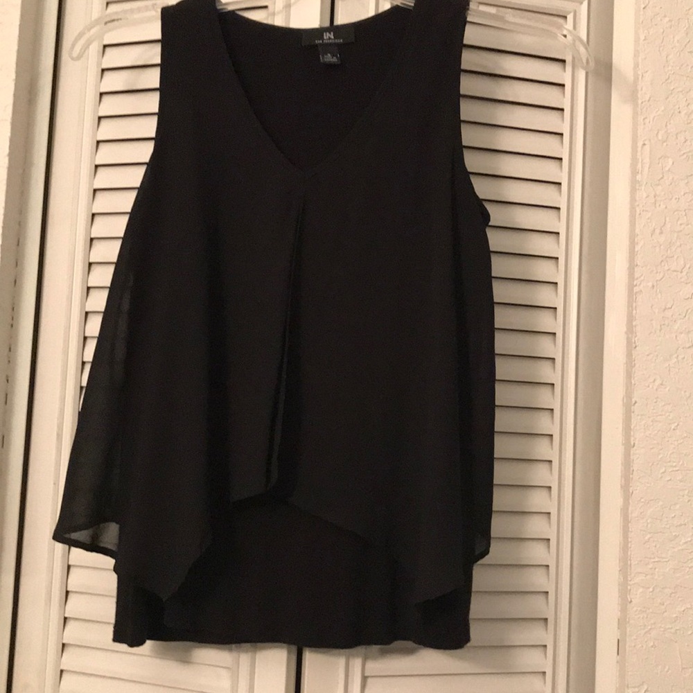 Black sleeveless blouse with sheer overlay